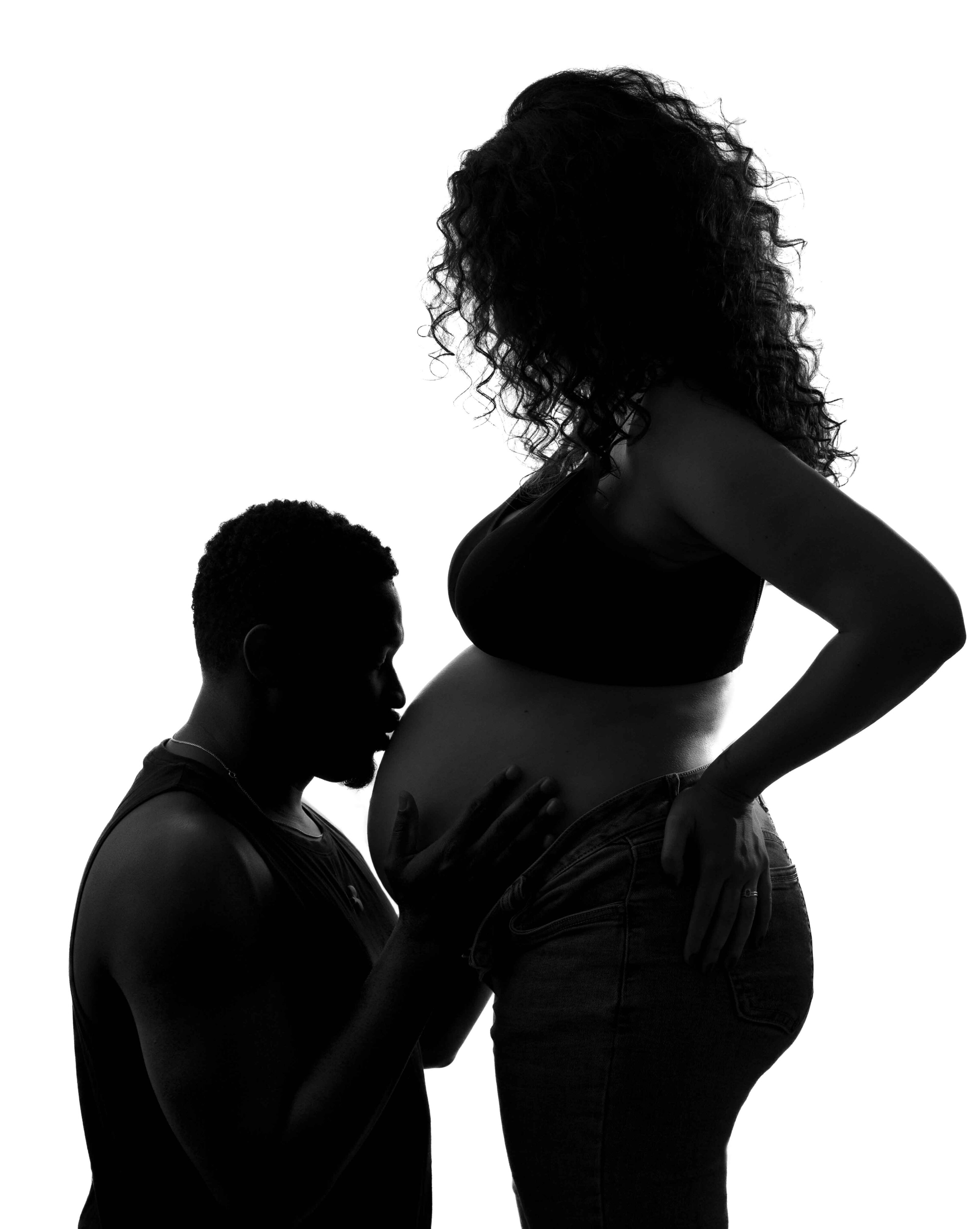 silhouette couple pregnancy photography white background kiss on bump