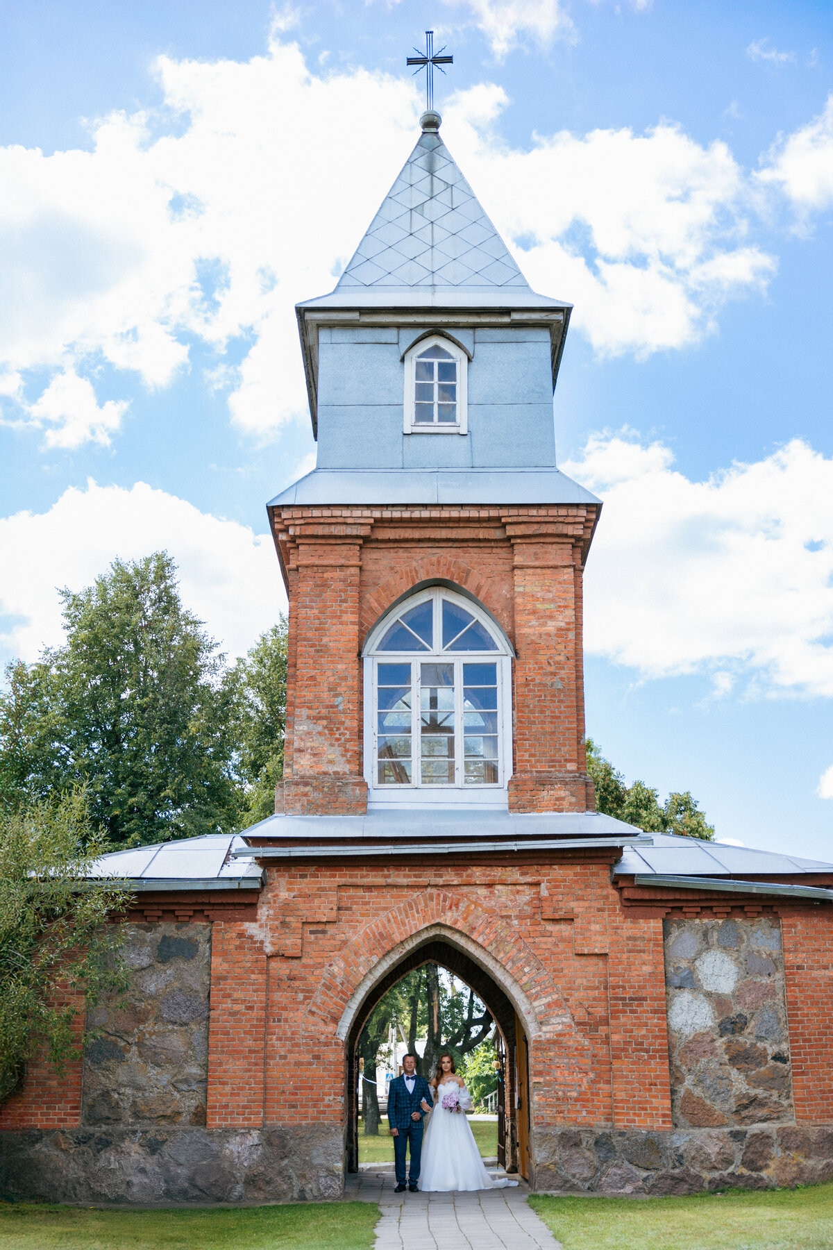 father guiding daughter to altar church
