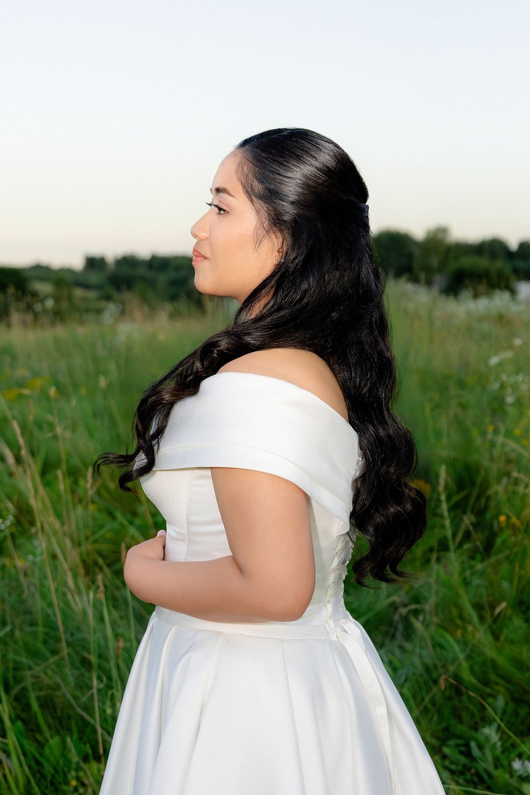 bride portrait during sunset in grass field lithuania