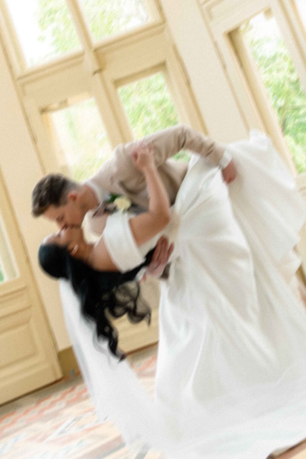Couple sharing their first dance in a manor hall