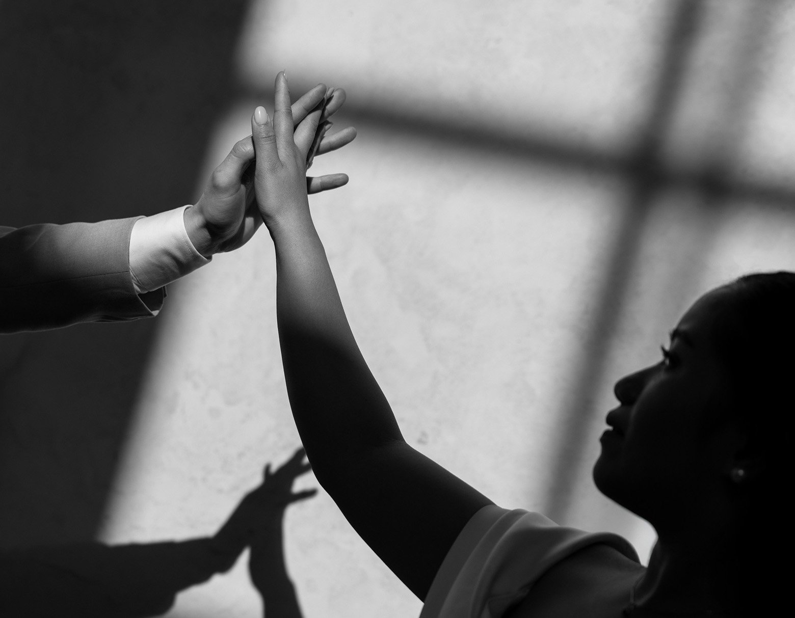 playing with shadows and hands wedding photography bw