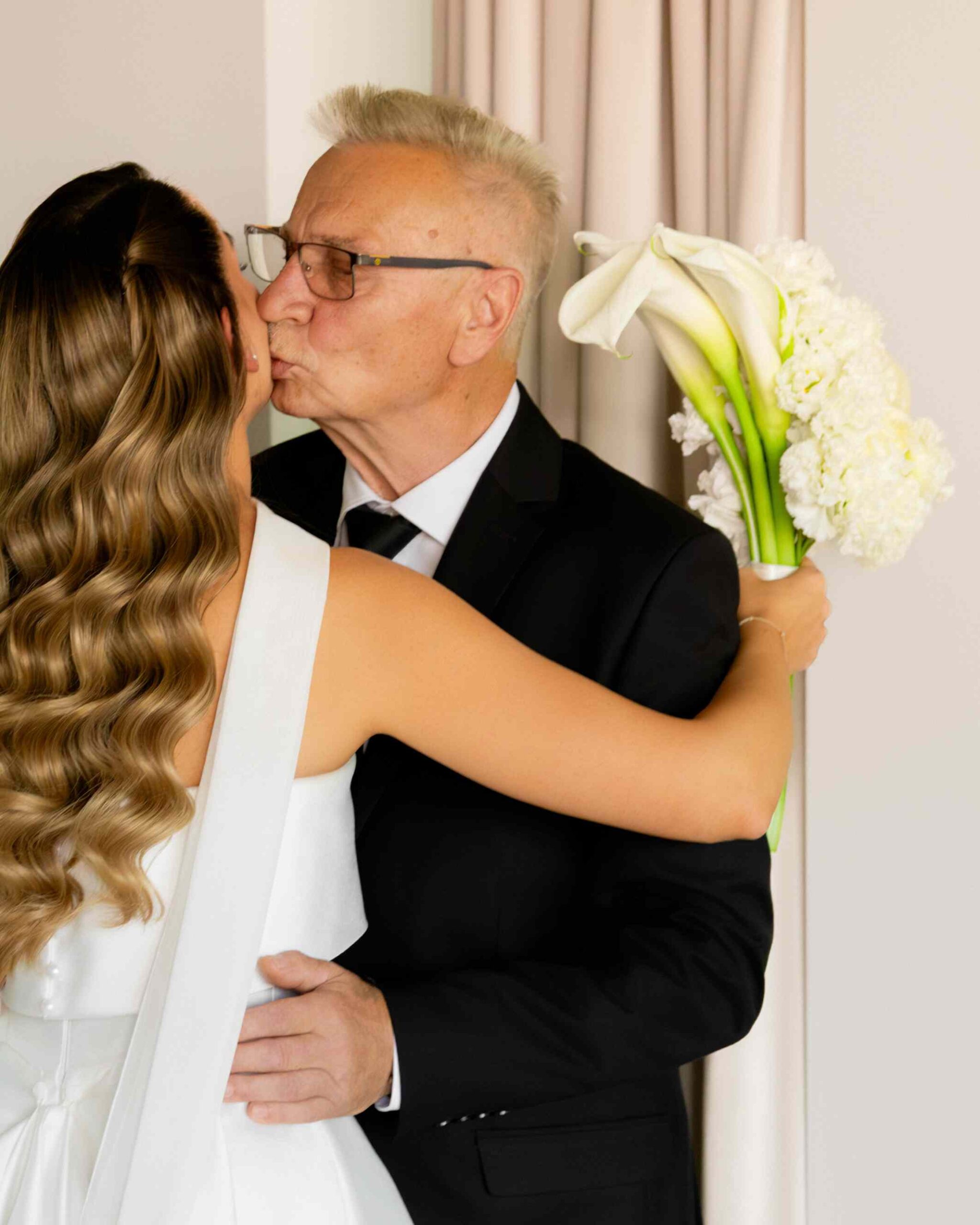 daughter father kiss on cheek wedding morning