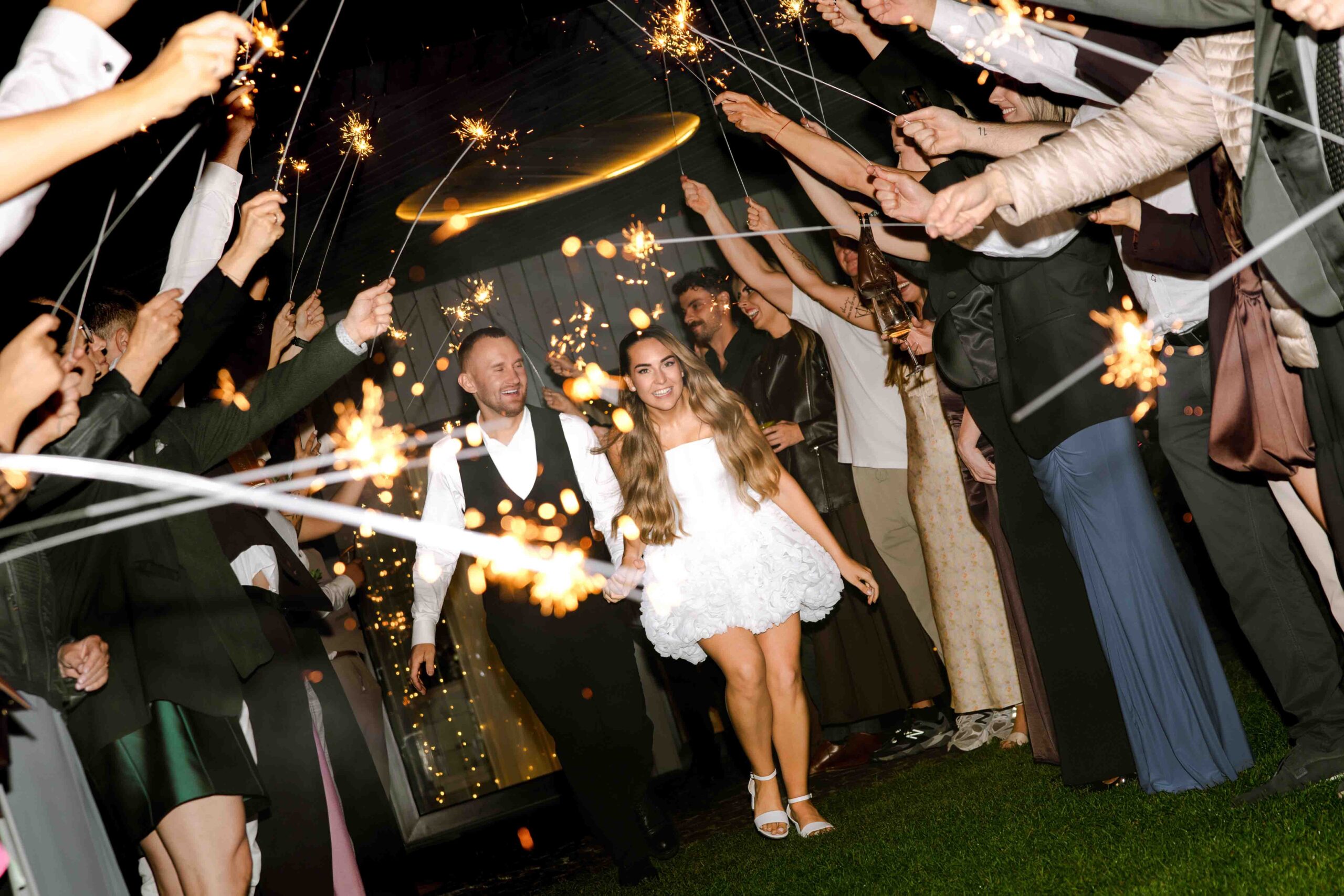 sparklers tunnel on-= wedding night guests