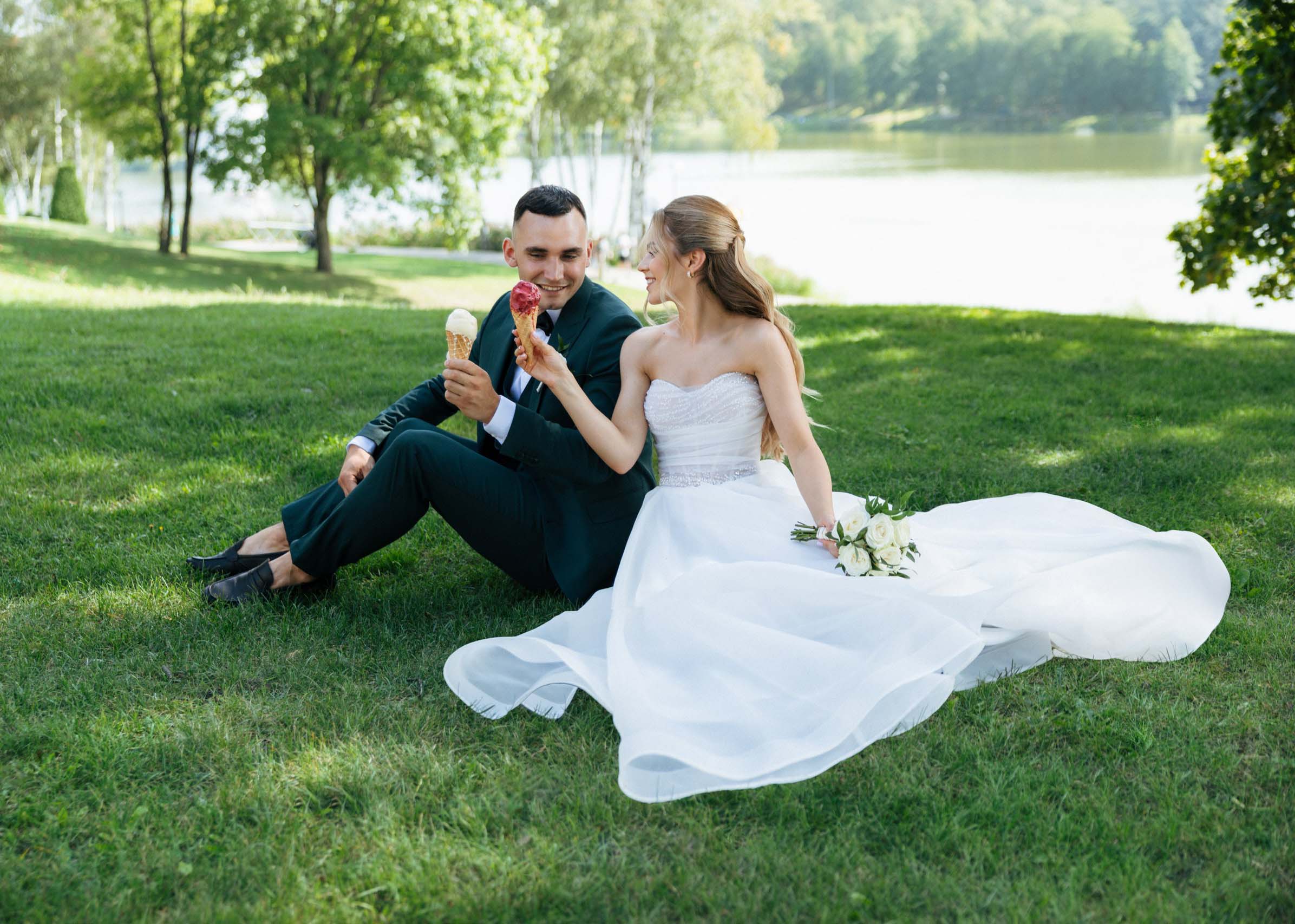 share gelato on wedding day in park couple