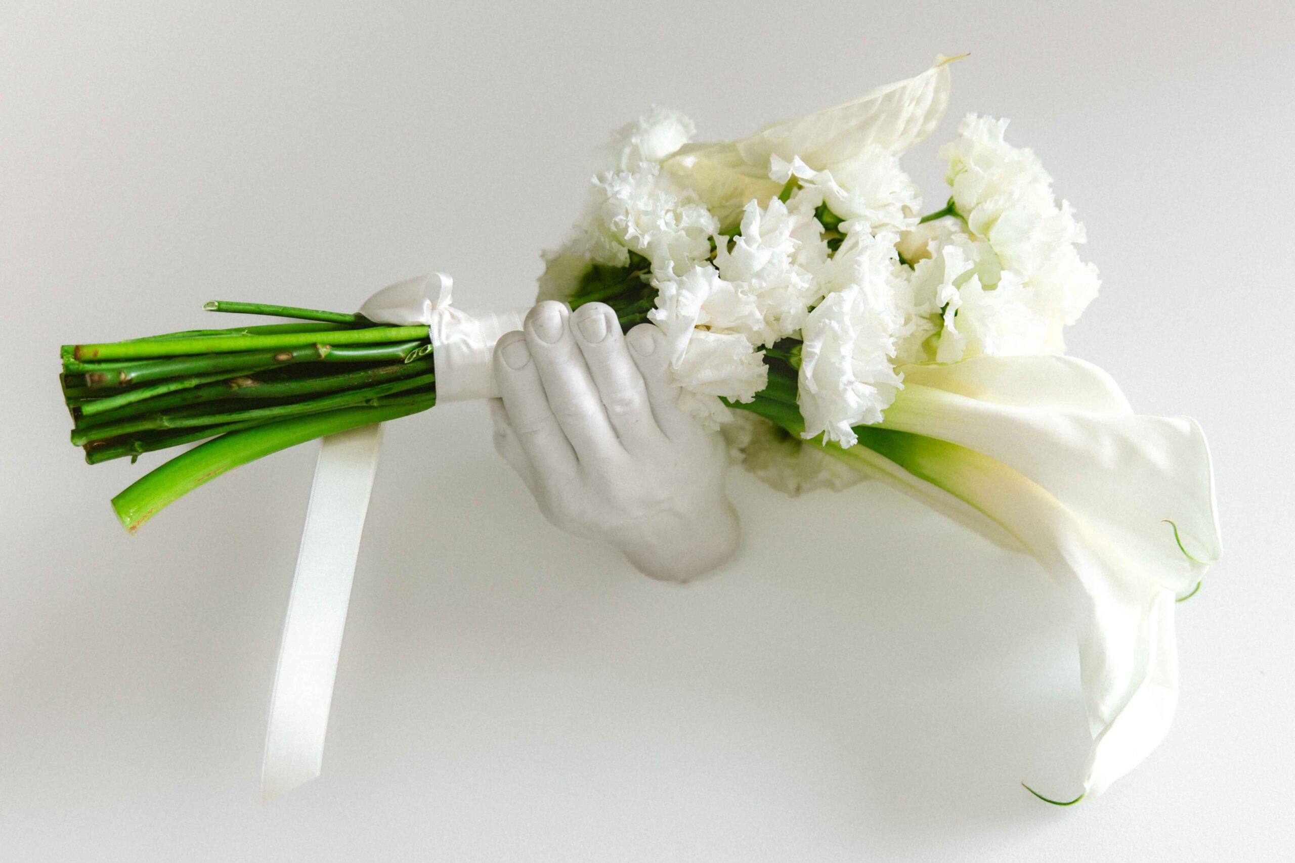 bride boquet white flowers in architecture hand
