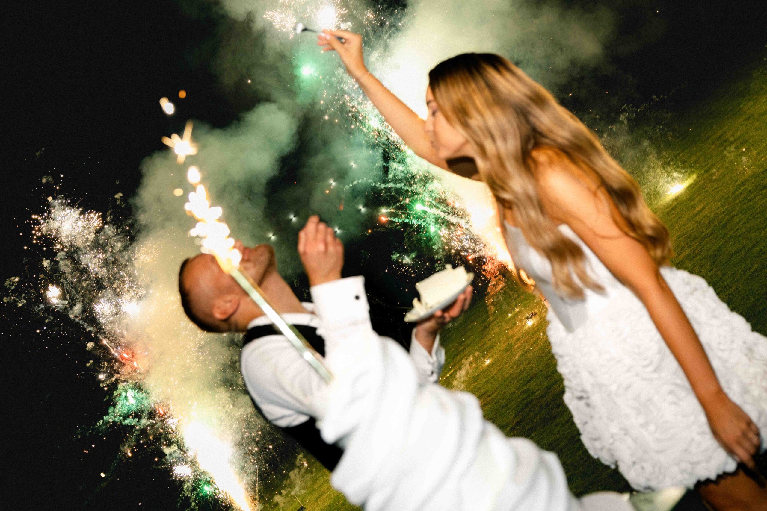 cake cutting ceremony with cold fireworks at night