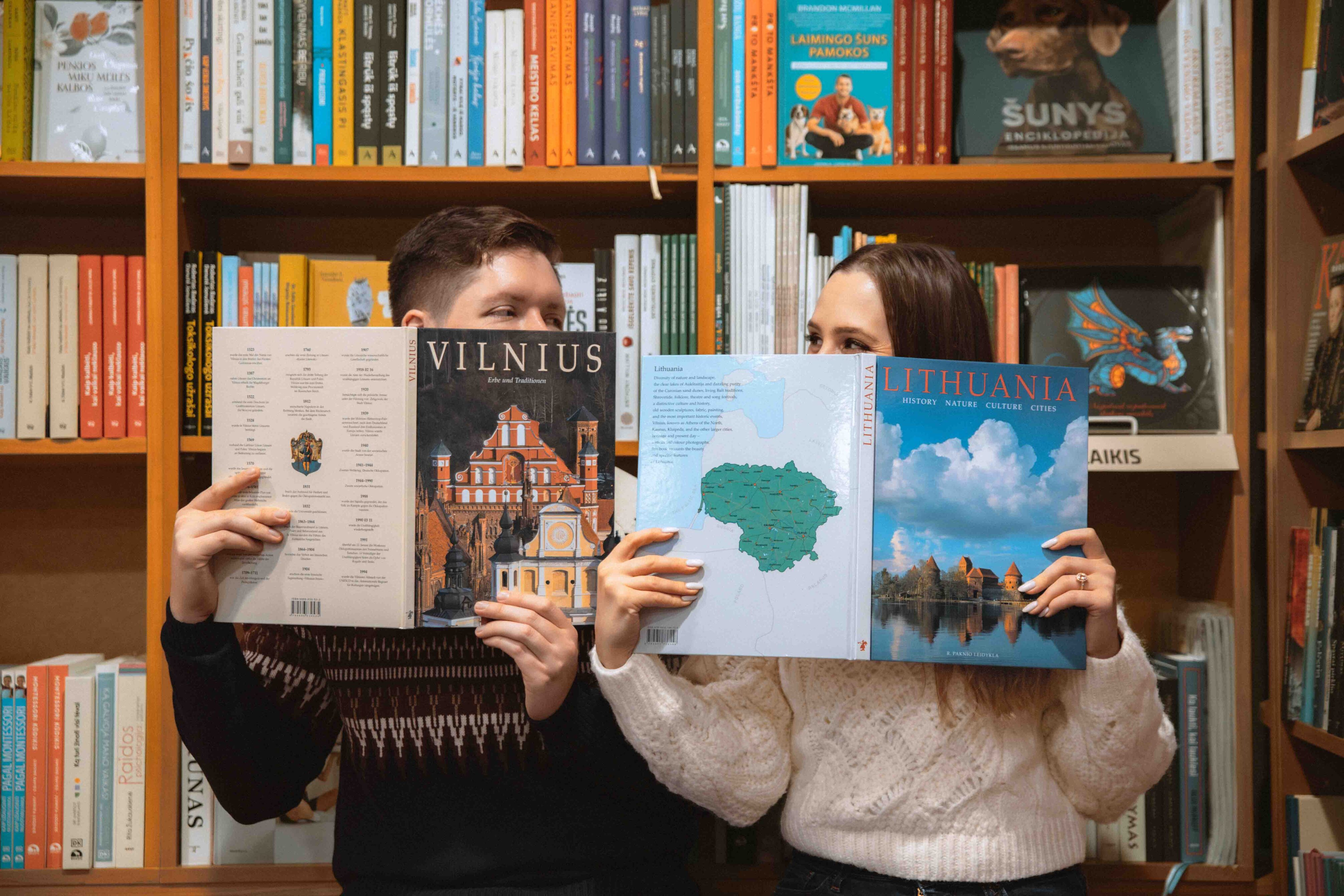 couple photoshoot in library cafe book engagement