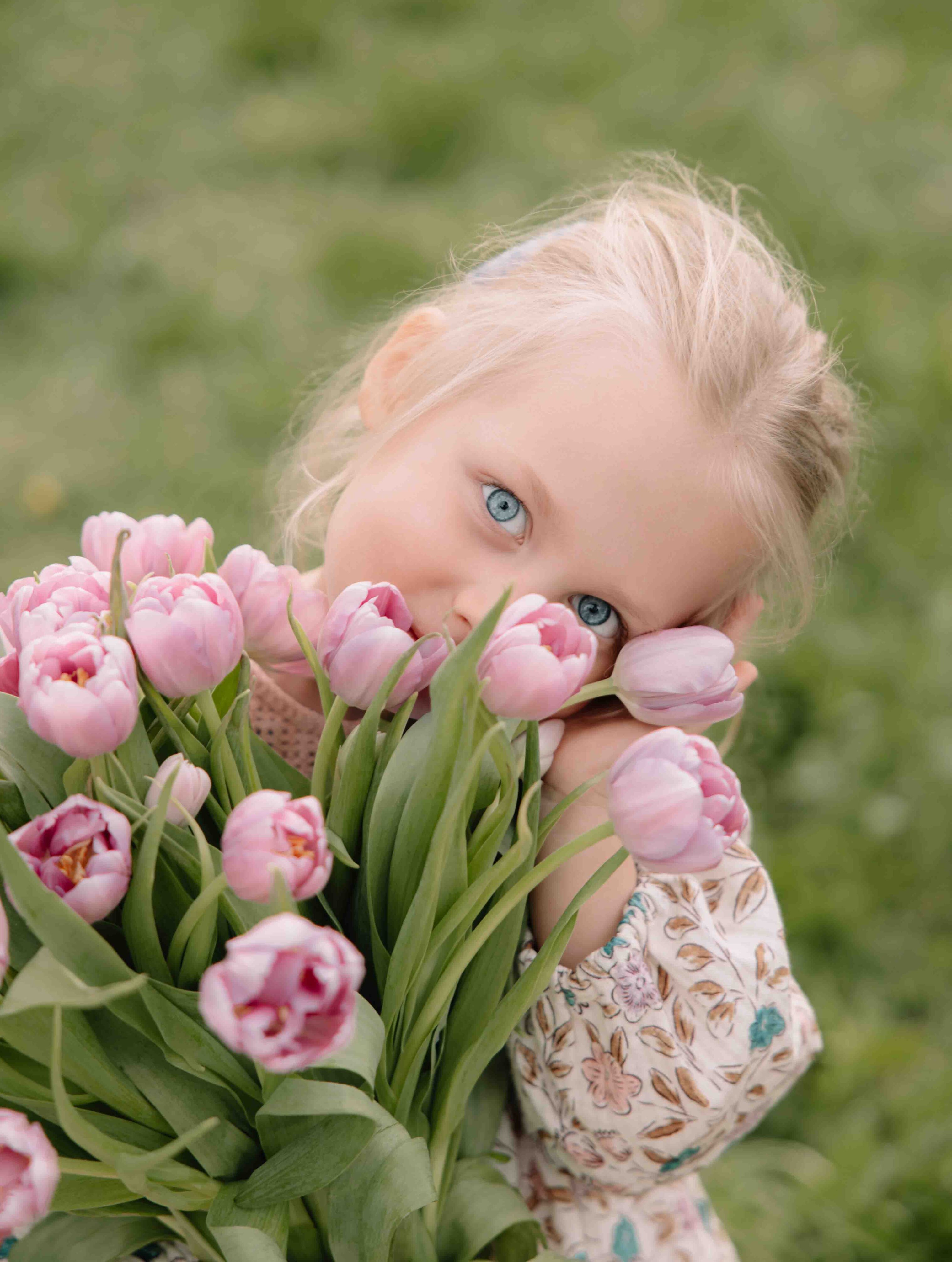cute girl portrait with tulips spring photoshooot