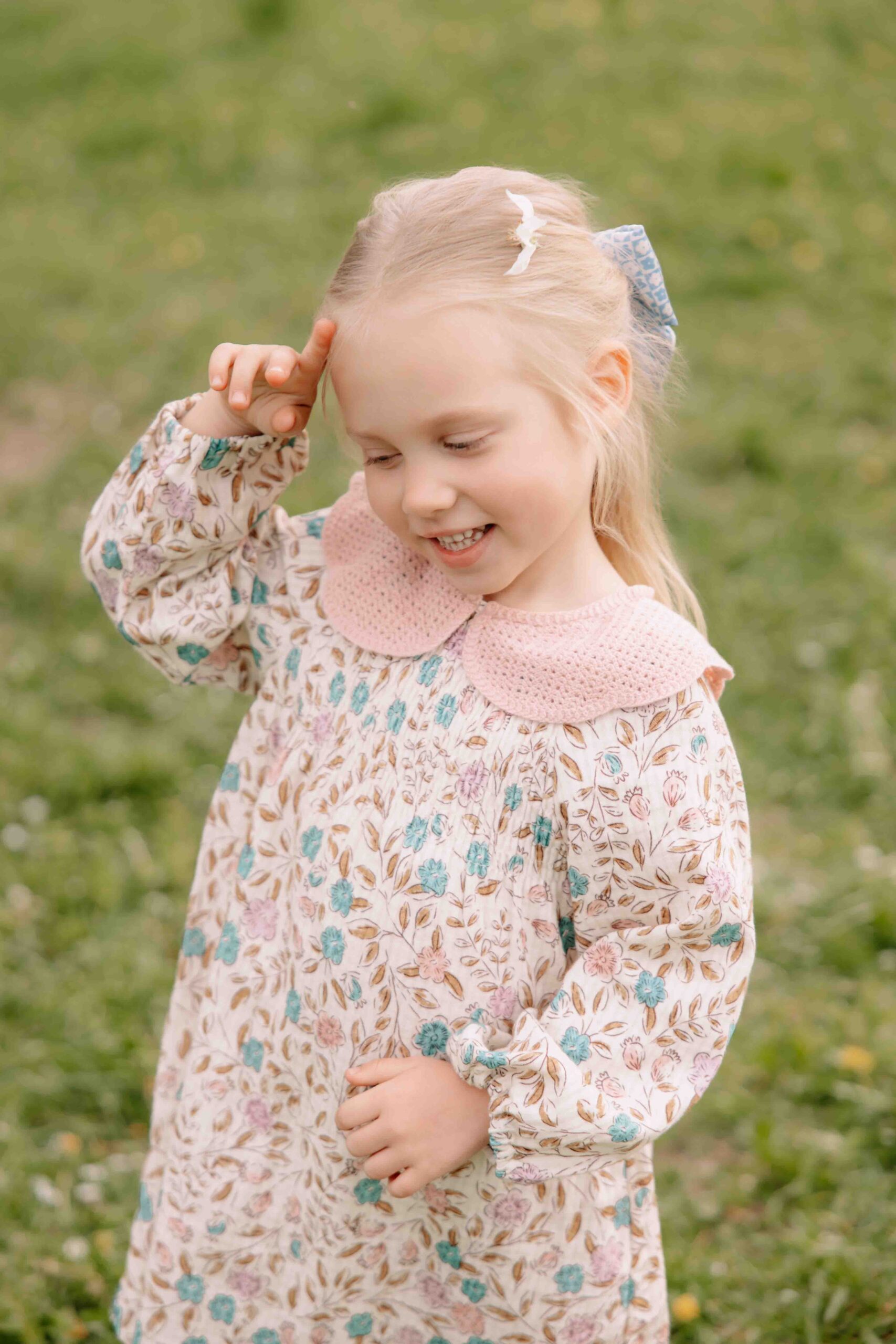 little girl portrait with flower on head belmontas