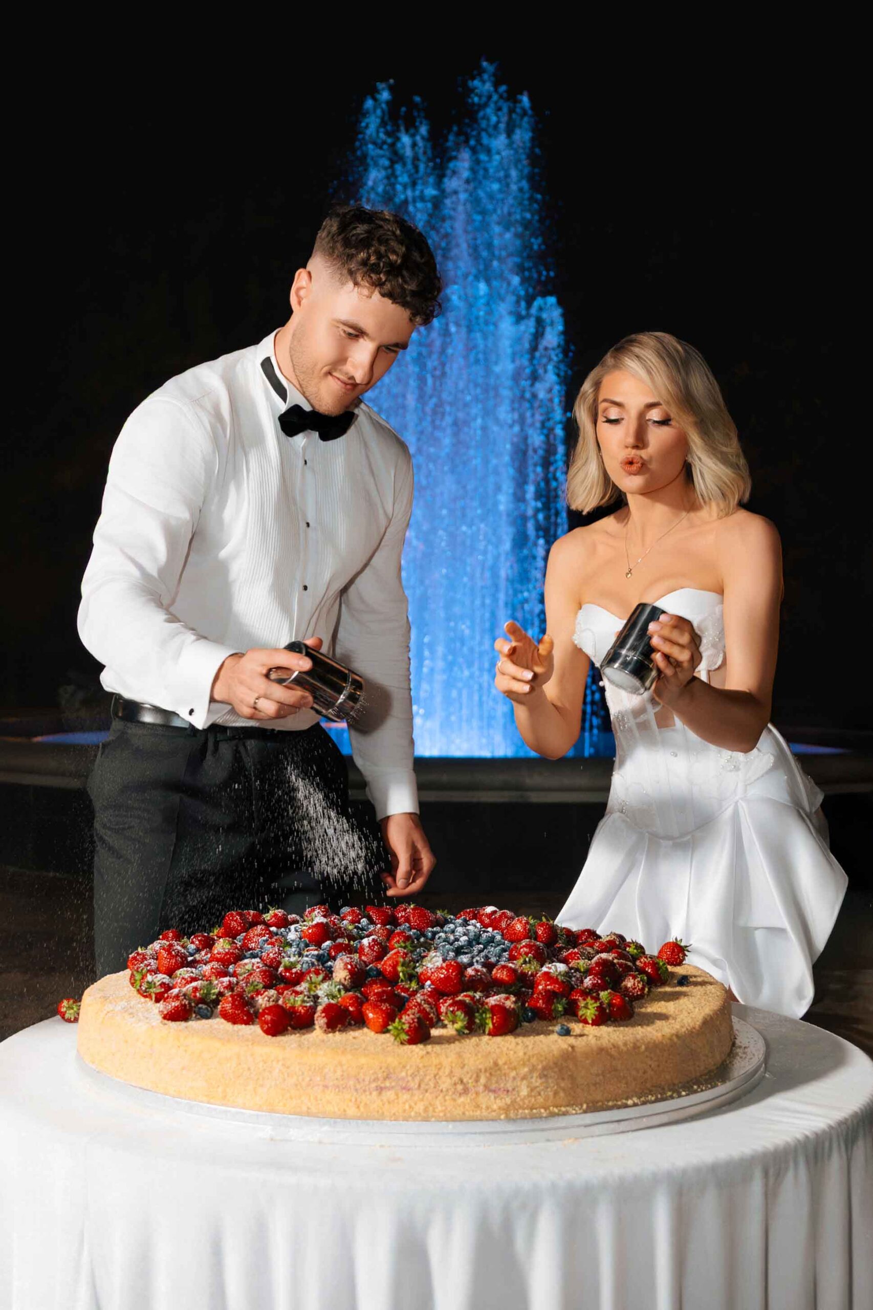 wedding couple decorating cake night