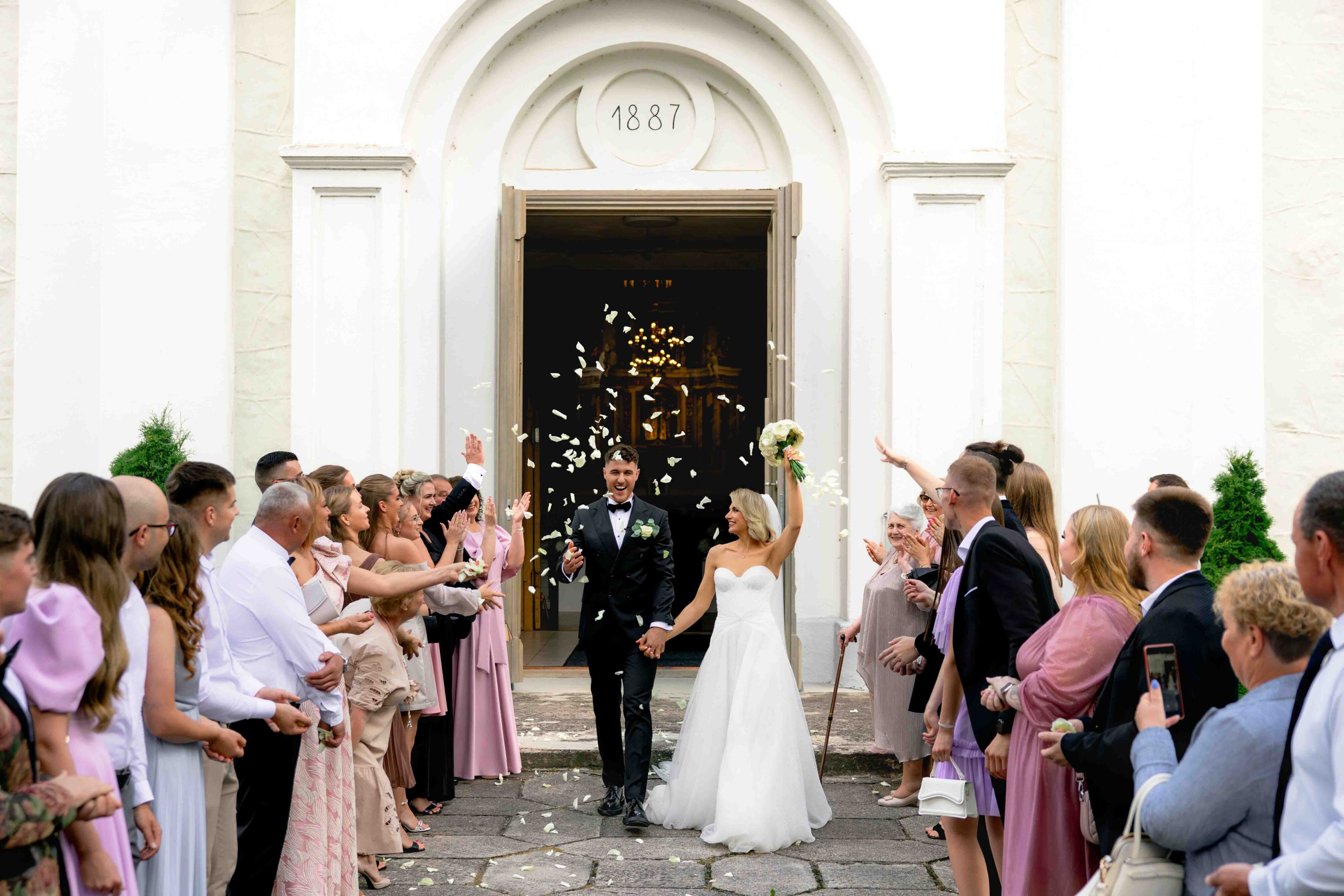 wedding newlyweds going through petals