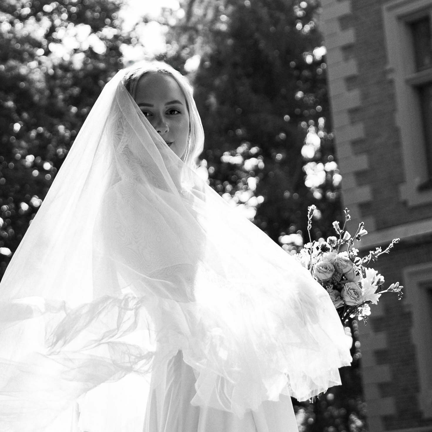 bride portrait ruffled veil in nature outdoors