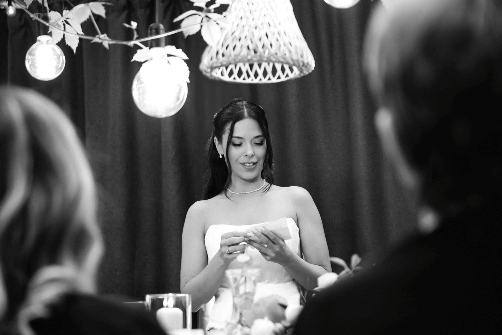 bride reads speach at table