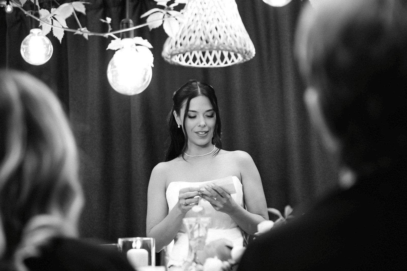 bride reads speach at table