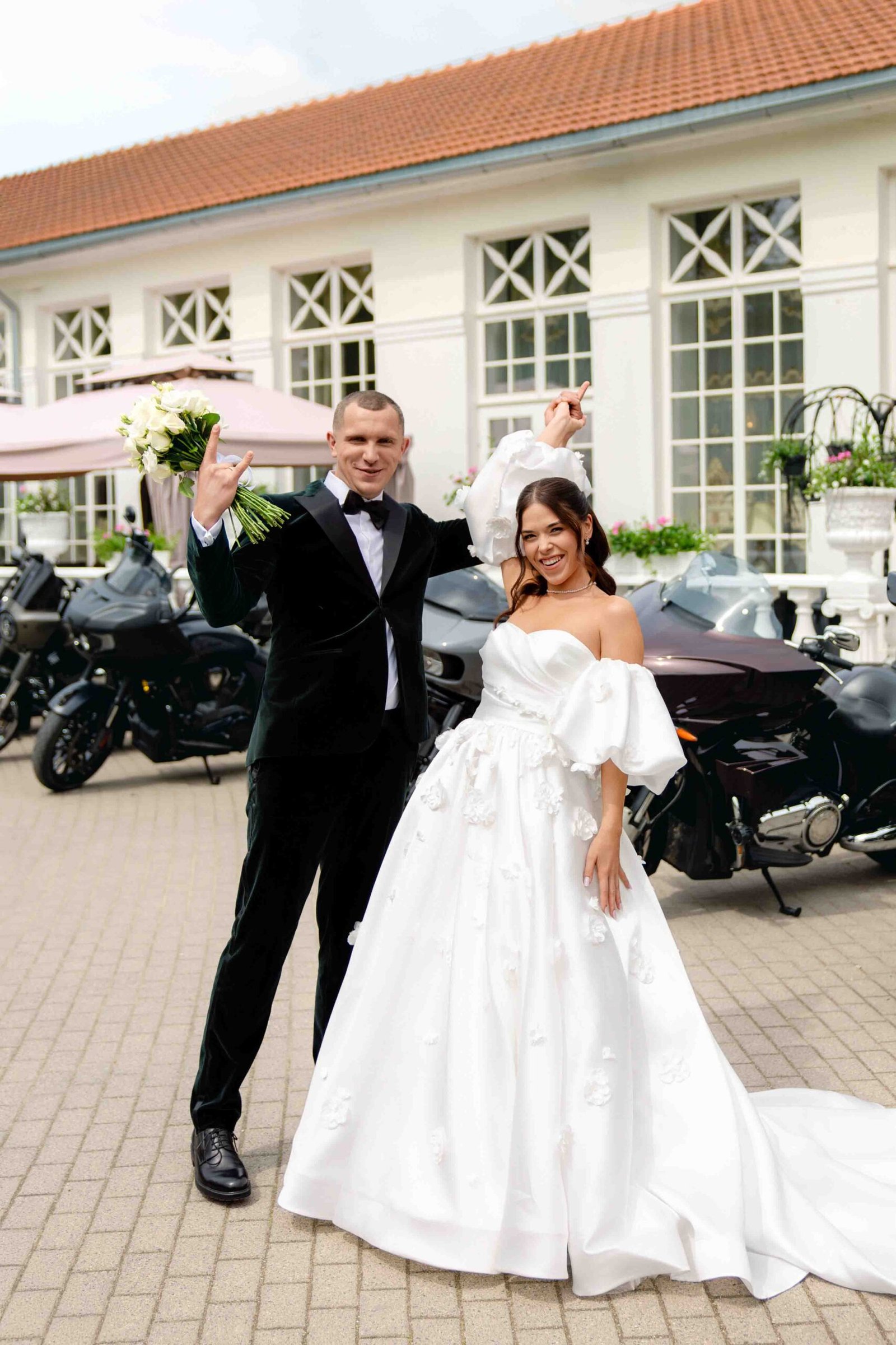 wedding photoshoot next to travel motorcycles happy couple
