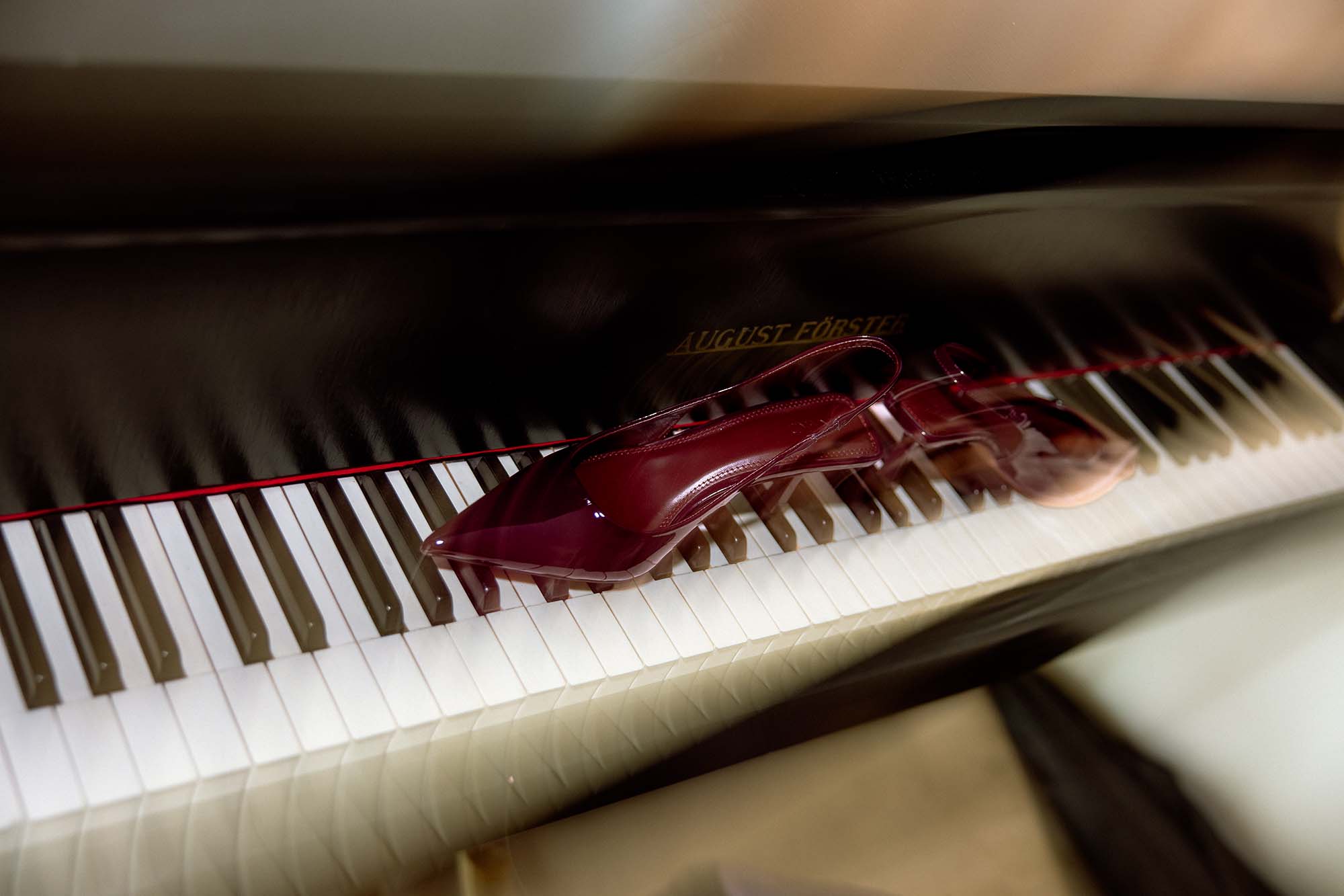 bride burgundy shoes on piano details photo