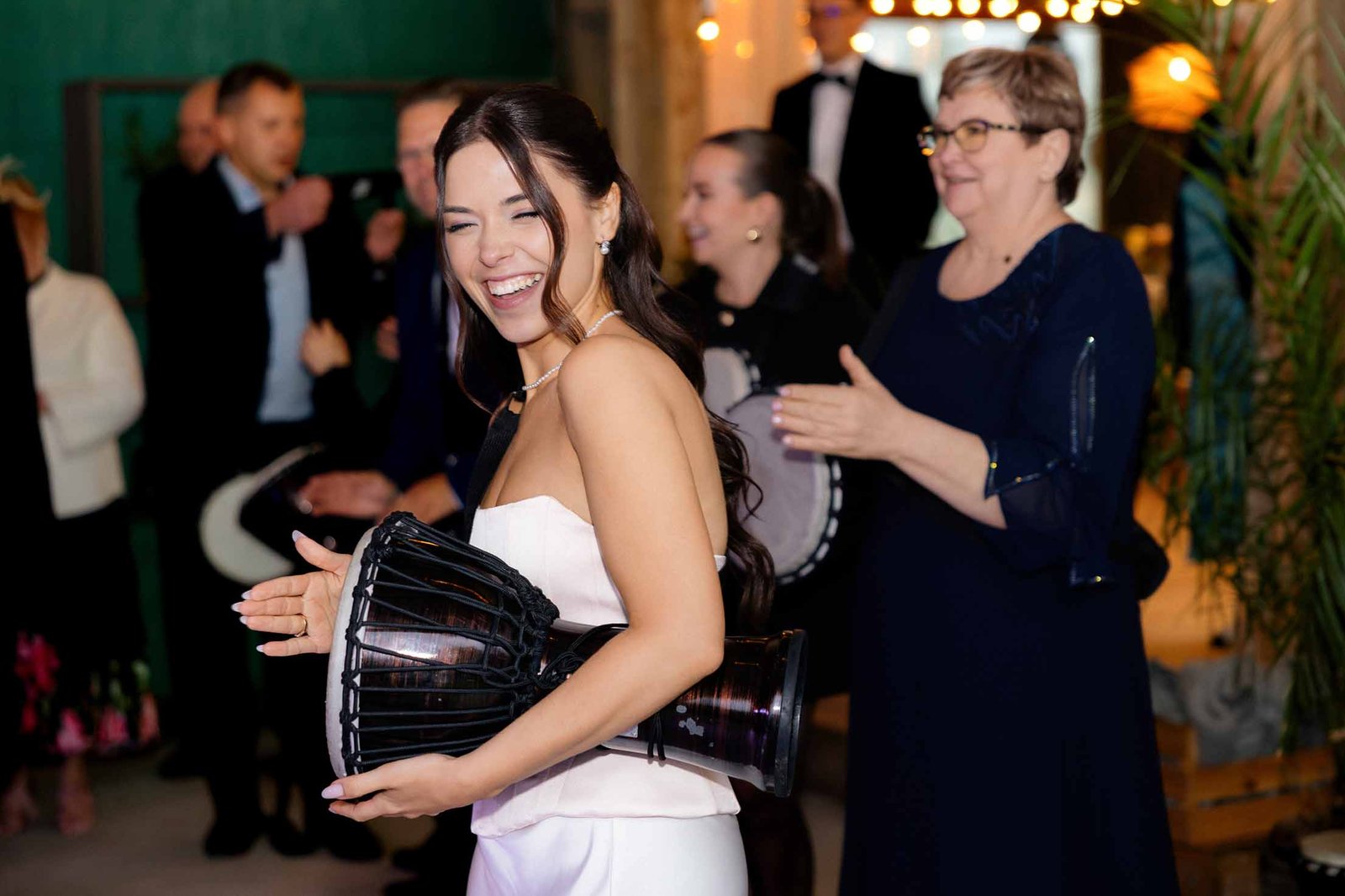 bride playing with afro drums wedding