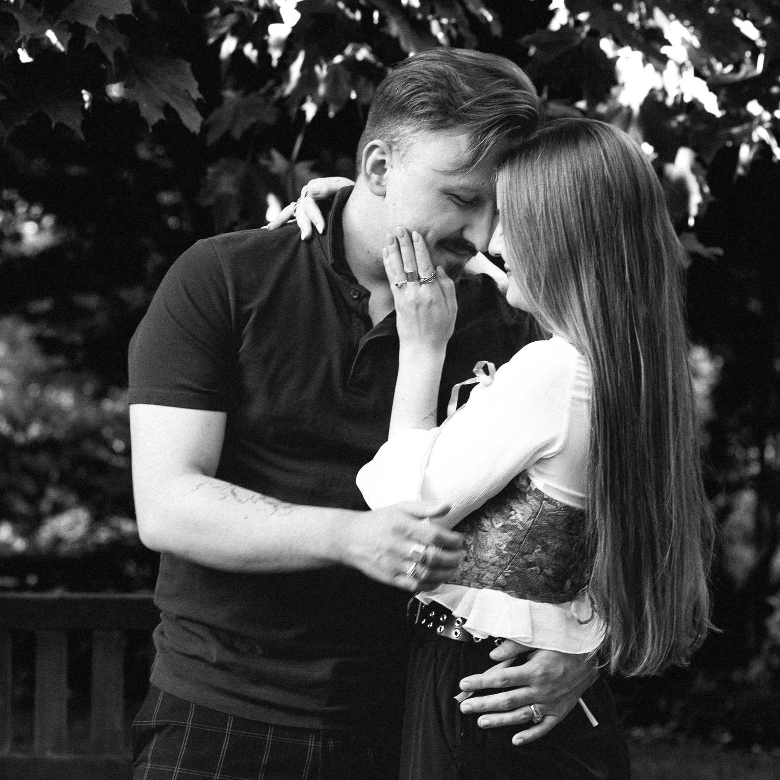 Close embrace between the newly engaged couple right after the surprise proposal in Vilnius.