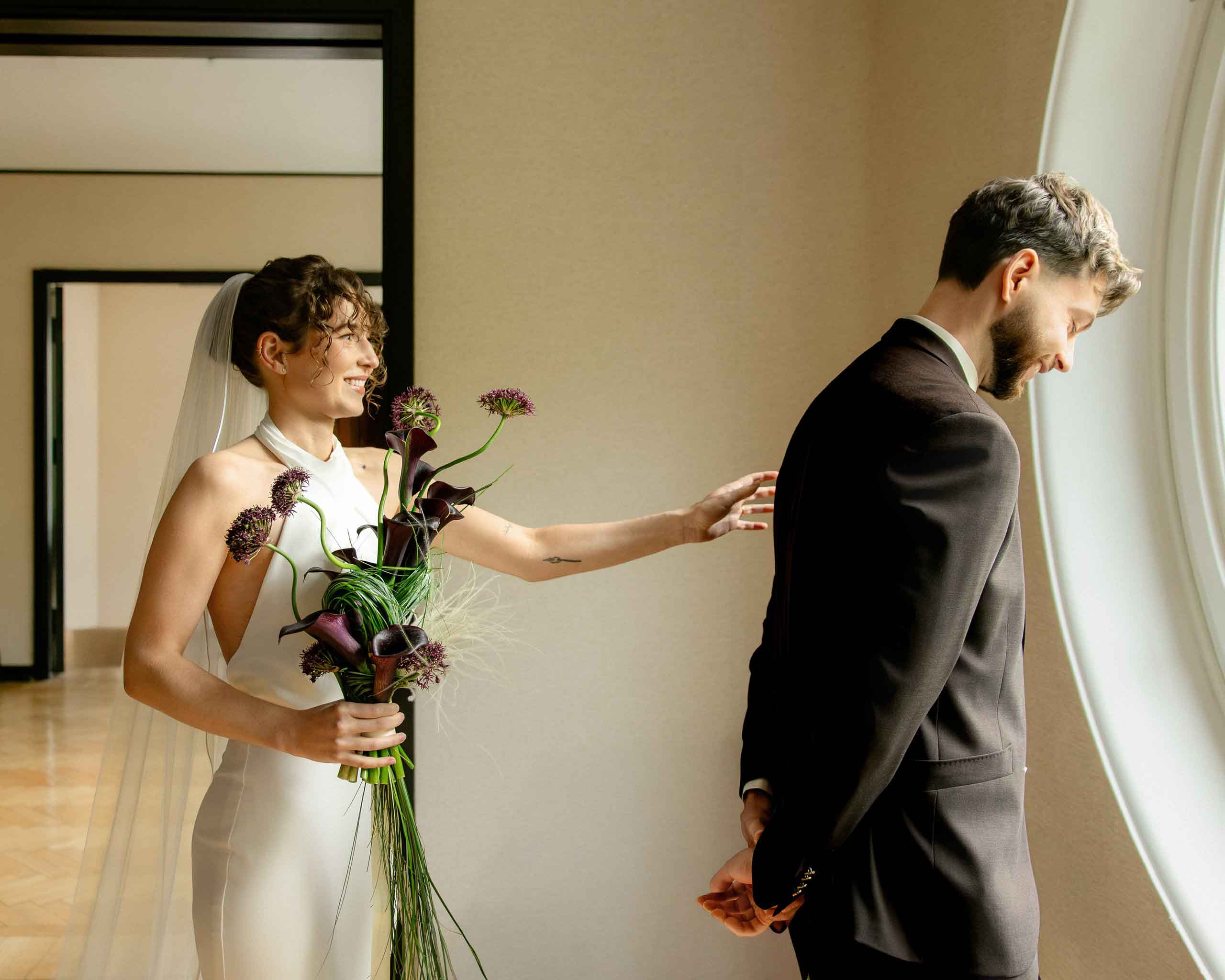 first look moment indoors modern city wedding milan