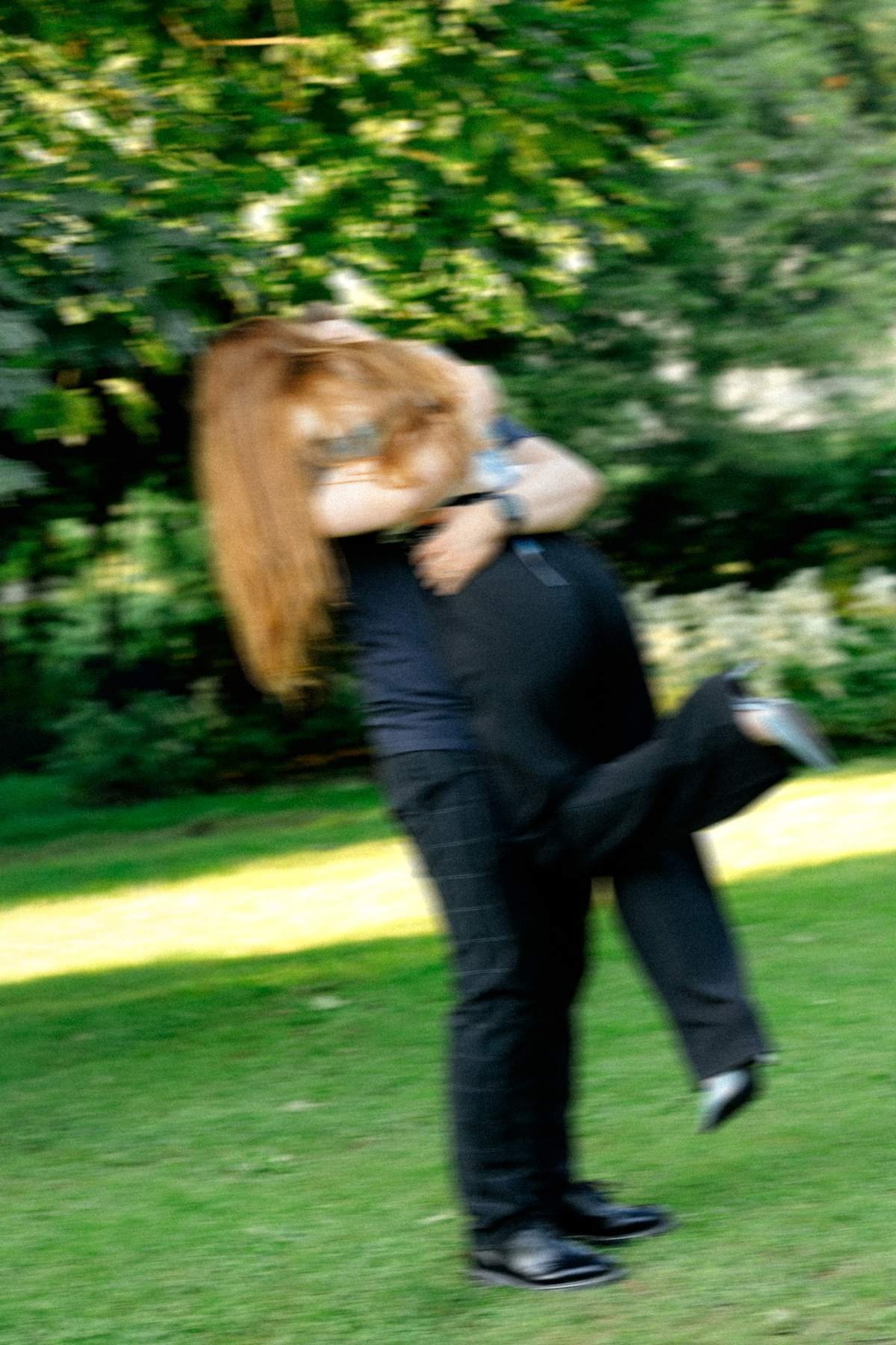 Evaldas spinning Brigita around joyfully after she said yes.