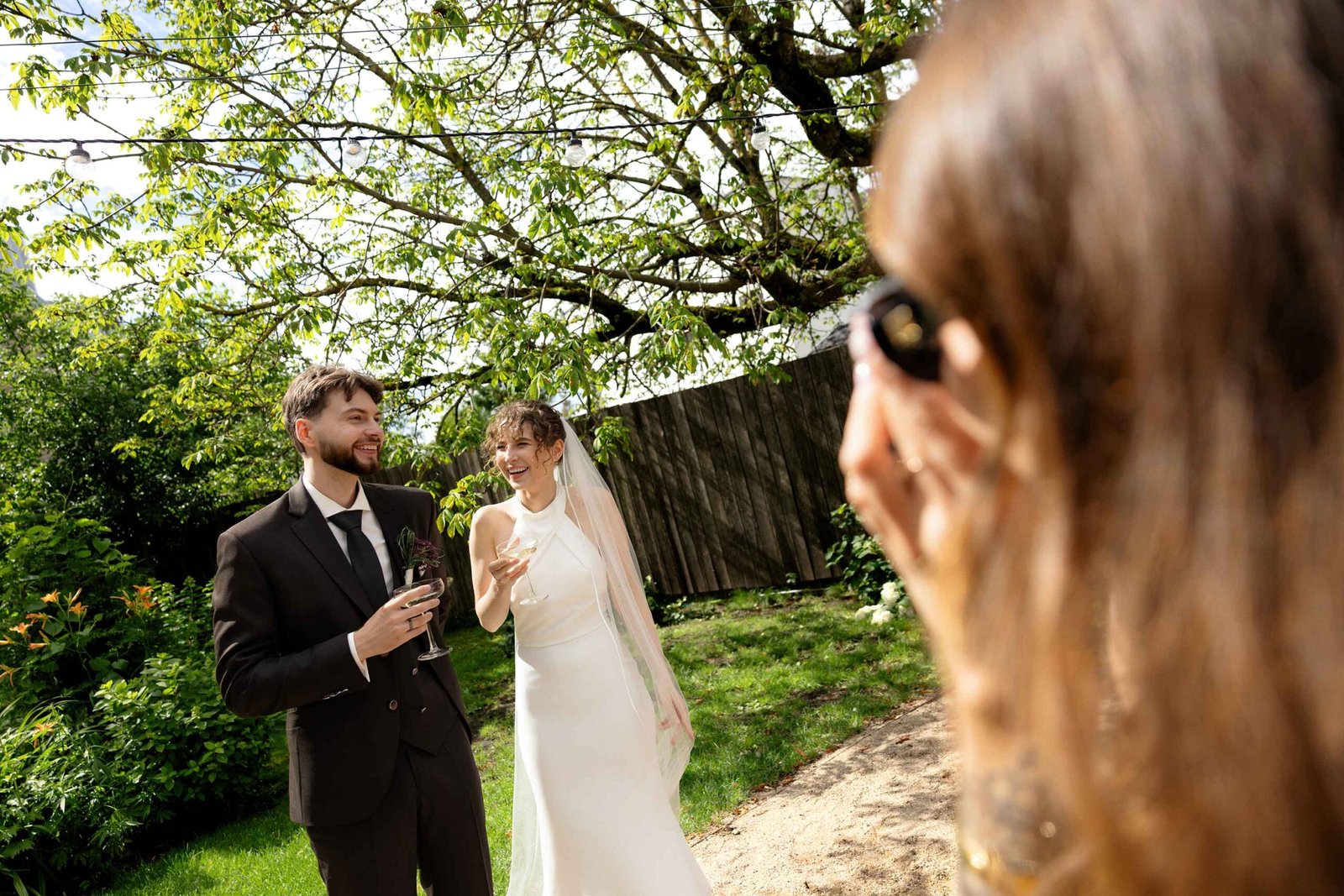 wedding guest capturing newlyweds on instatnt camera